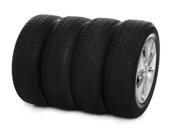 Photo of Set of wheels with winter tires on white background