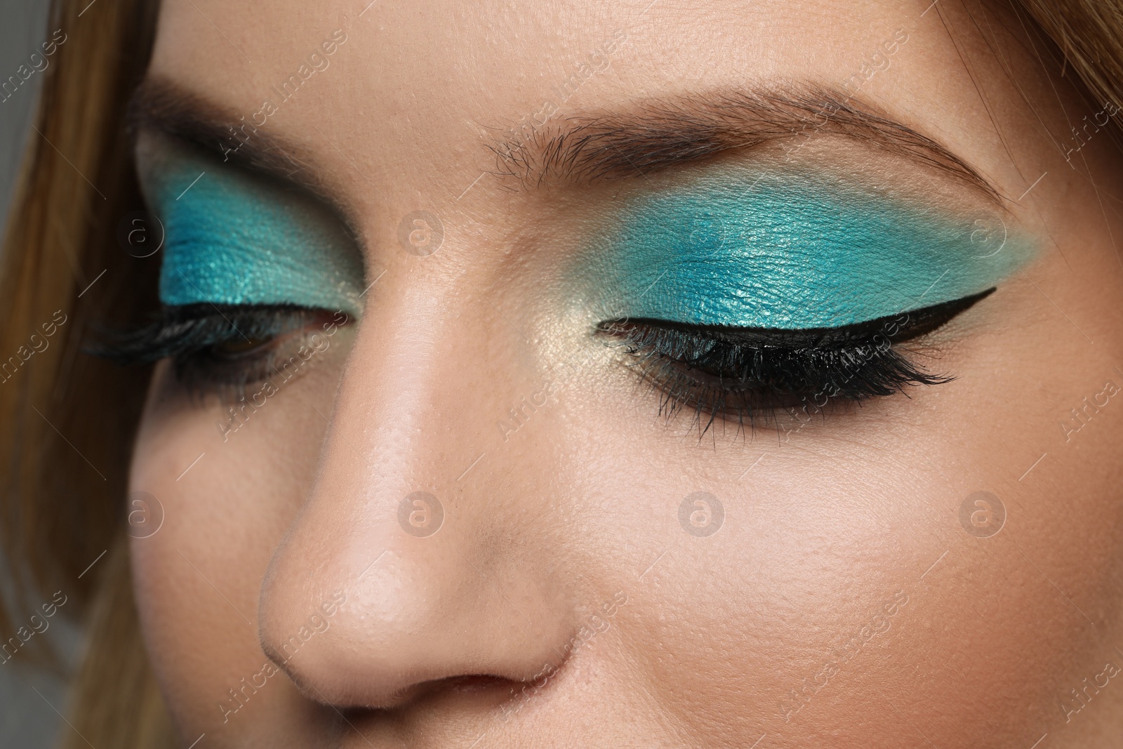 Young woman with evening makeup, closeup. Eye shadow product Photo of Young woman with evening makeup, closeup. Eye shadow product