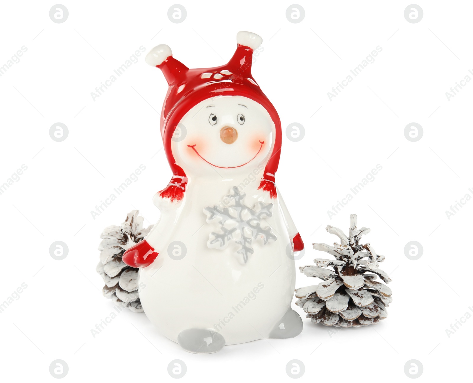 Decorative snowmen near cones on white background Photo of Decorative snowmen near cones on white background