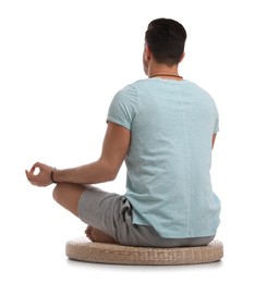 Photo of Man meditating on white background, back view