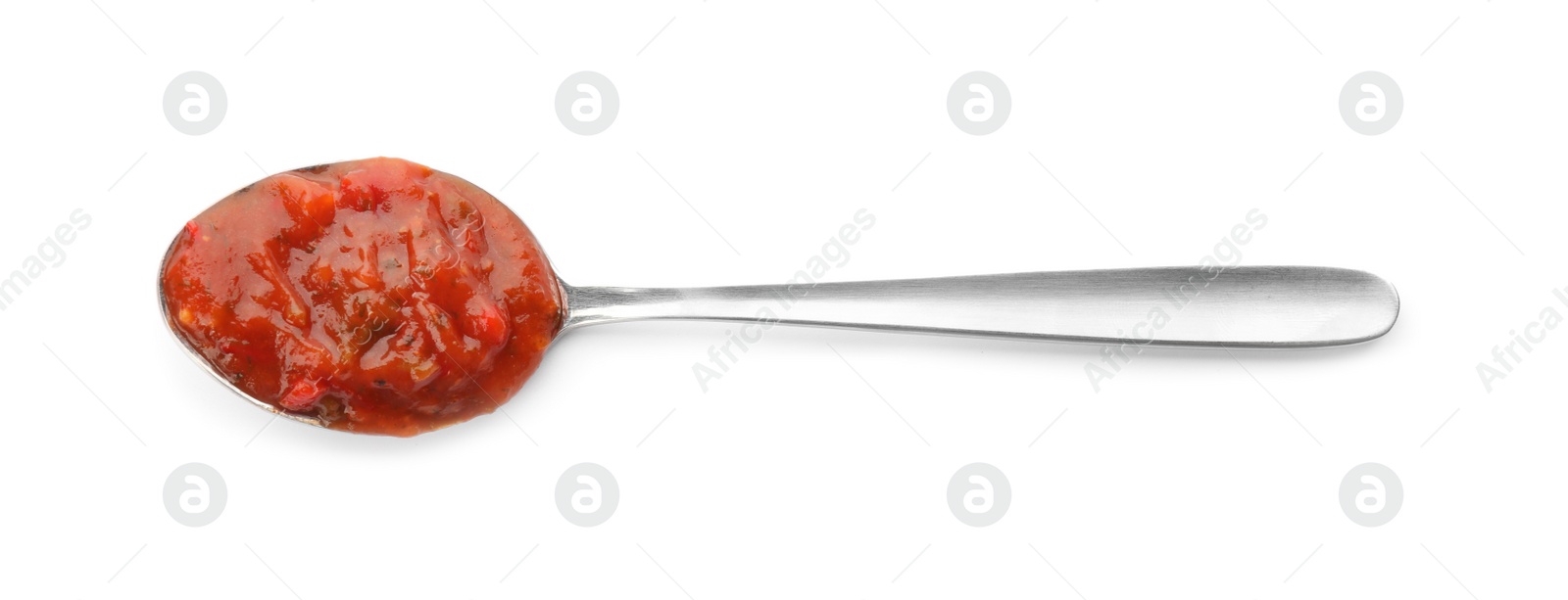 Delicious adjika sauce in spoon isolated on white, top view Photo of Delicious adjika sauce in spoon isolated on white, top view