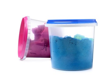 Kinetic sand and toys in buckets on white background Photo of Kinetic sand and toys in buckets on white background