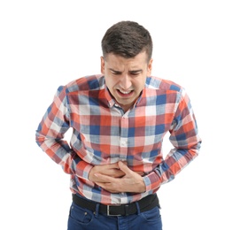 Photo of Young man suffering from abdominal pain on white background