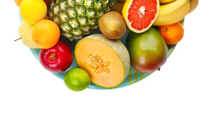 Plate with fresh tropical fruits on white background Photo of Plate with fresh tropical fruits on white background
