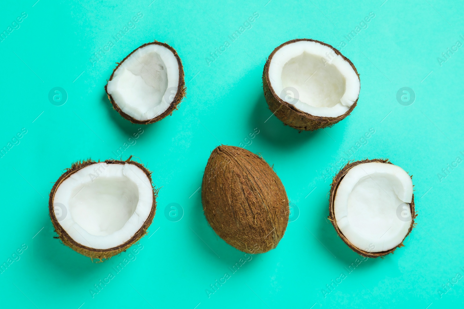 Ripe coconuts on color background Photo of Ripe coconuts on color background