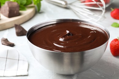 Delicious chocolate cream on grey marble table Photo of Delicious chocolate cream on grey marble table