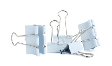 Different binder clips on white background. Stationery item Photo of Different binder clips on white background. Stationery item