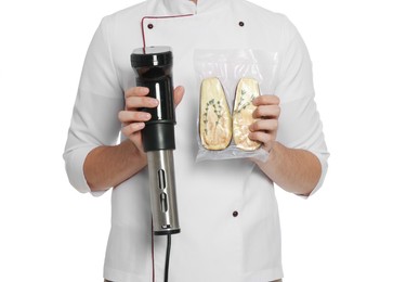 Chef holding sous vide cooker and eggplant in vacuum pack on white background, closeup Photo of Chef holding sous vide cooker and eggplant in vacuum pack on white background, closeup