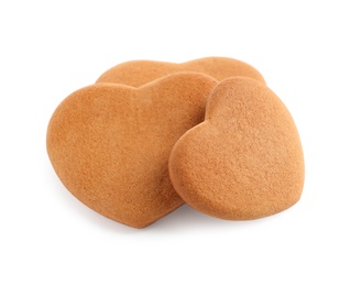 Tasty heart shaped gingerbread cookies isolated on white Photo of Tasty heart shaped gingerbread cookies isolated on white