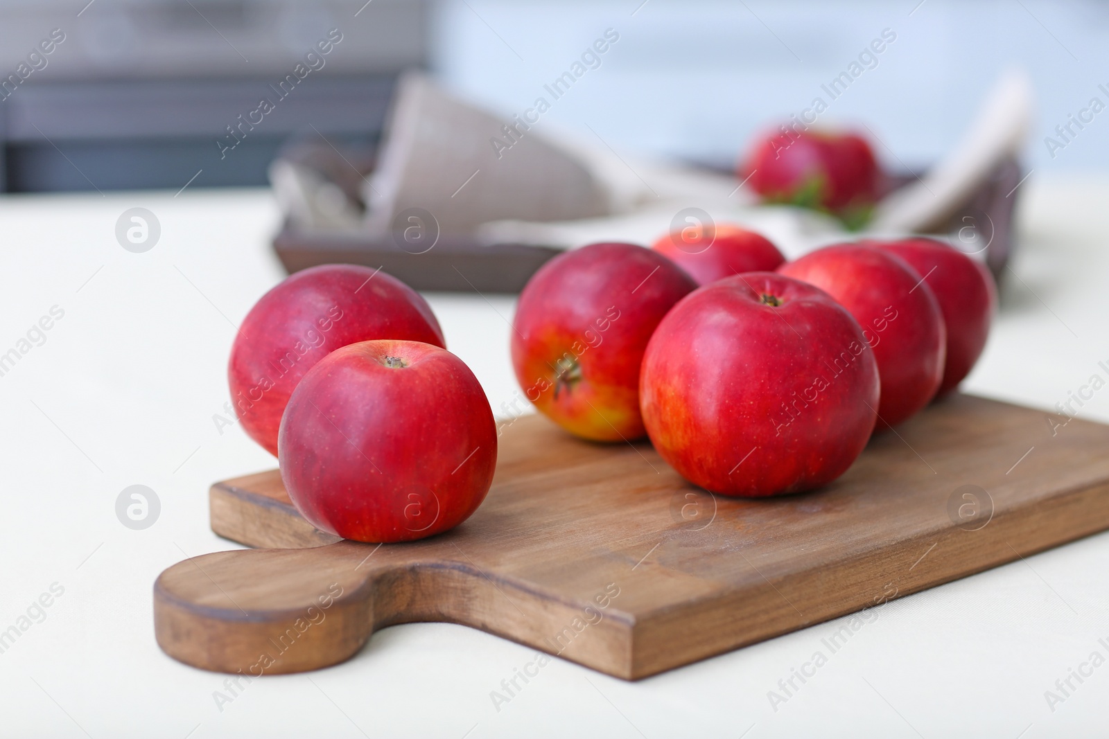 Ripe red apples on wooden board Photo of Ripe red apples on wooden board