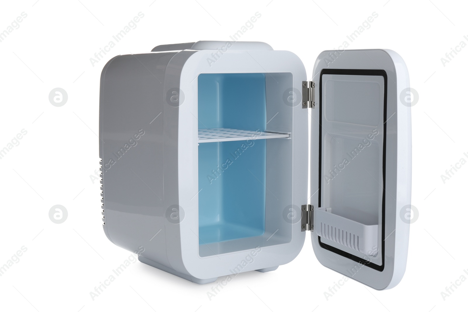 Open mini refrigerator for cosmetics isolated on white Photo of Open mini refrigerator for cosmetics isolated on white