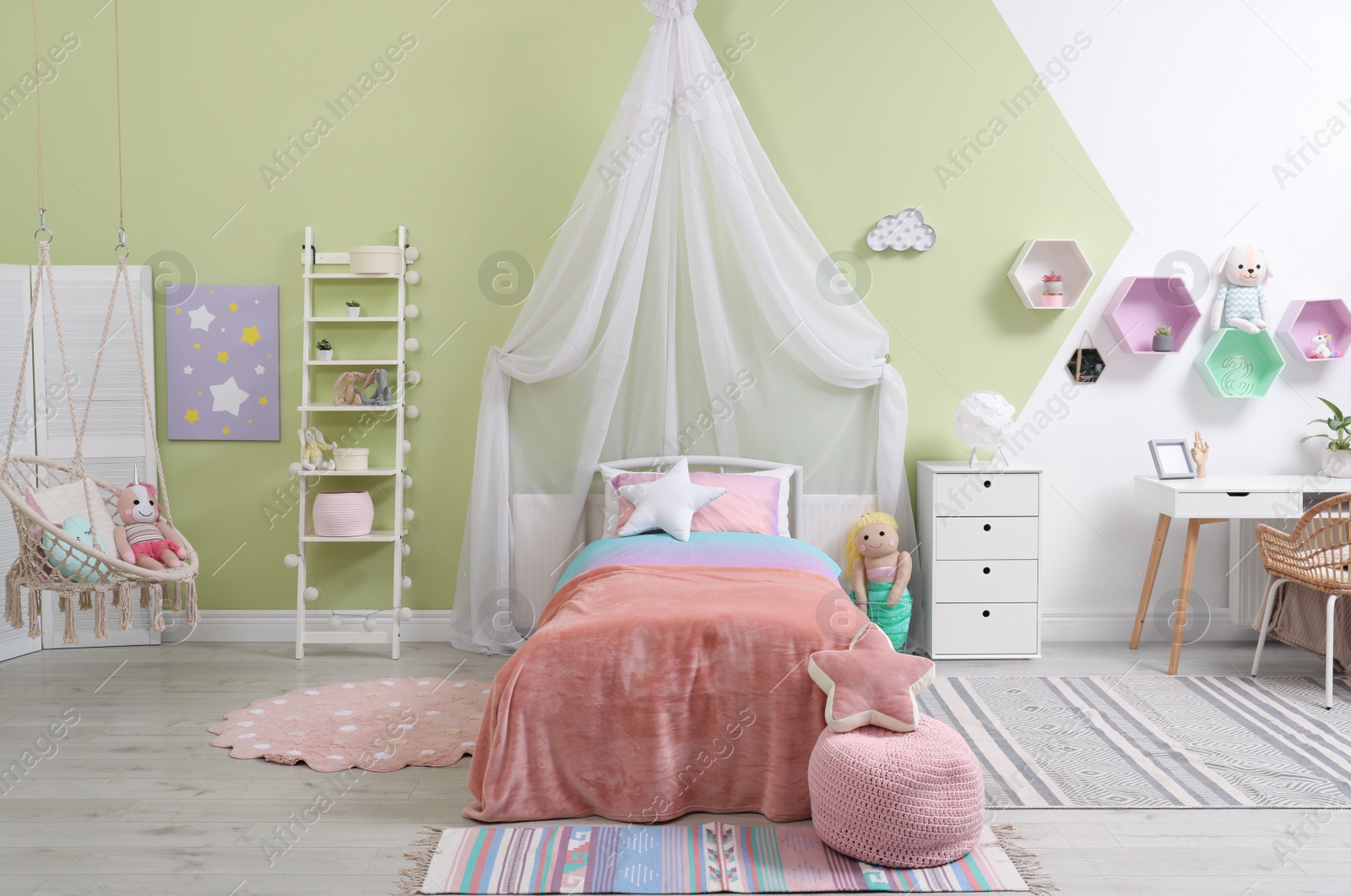Photo of Cute child's room interior with toys and modern furniture