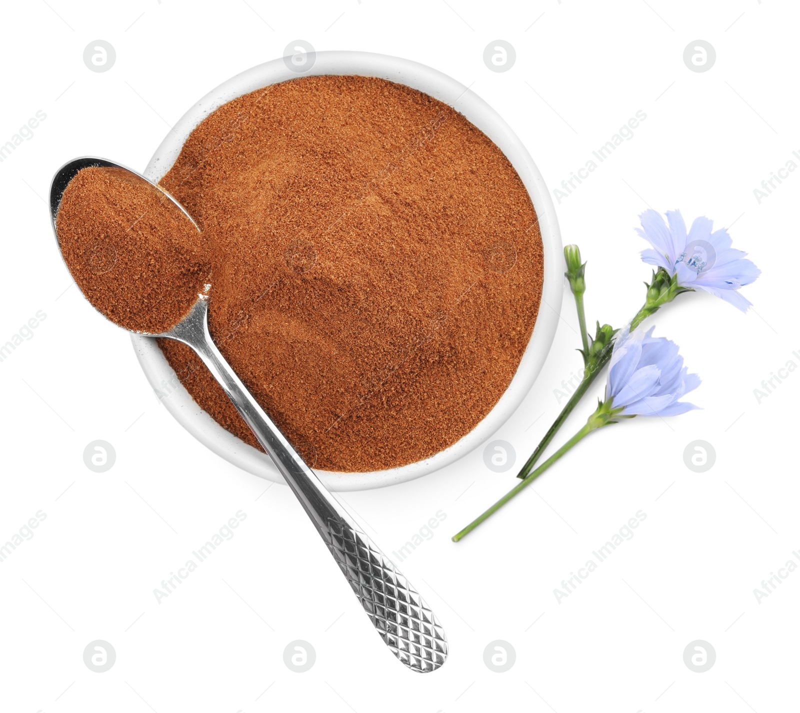 Plate and spoon of chicory powder with flowers on white background, top view Photo of Plate and spoon of chicory powder with flowers on white background, top view