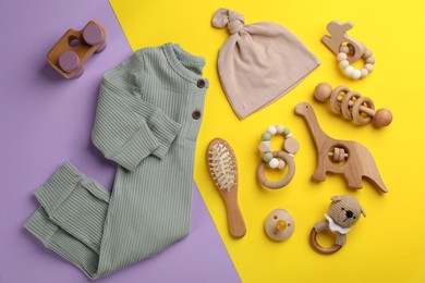 Flat lay composition with baby clothes and accessories on color background Photo of Flat lay composition with baby clothes and accessories on color background