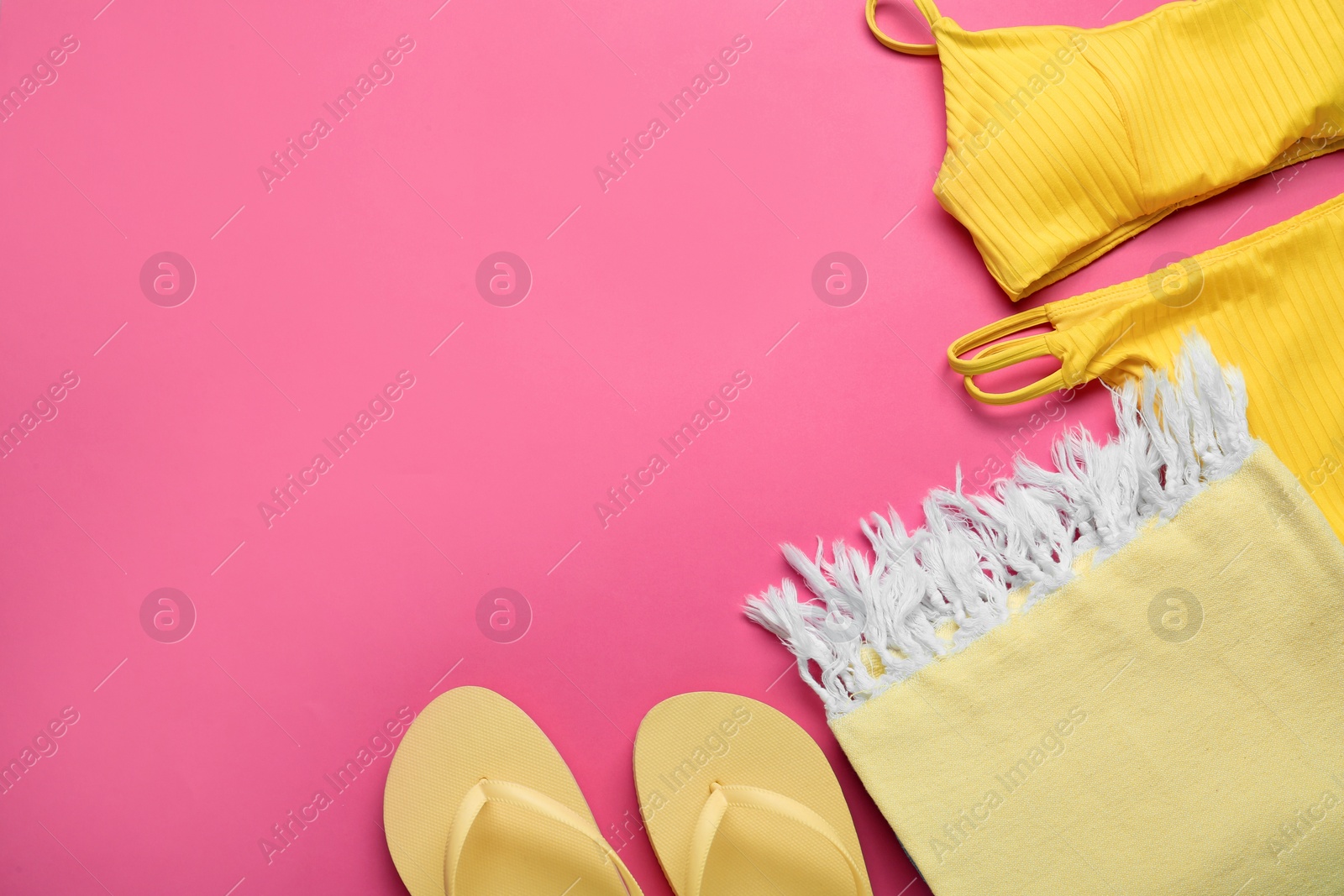 Flat lay composition with different beach objects on pink background, space for text Photo of Flat lay composition with different beach objects on pink background, space for text