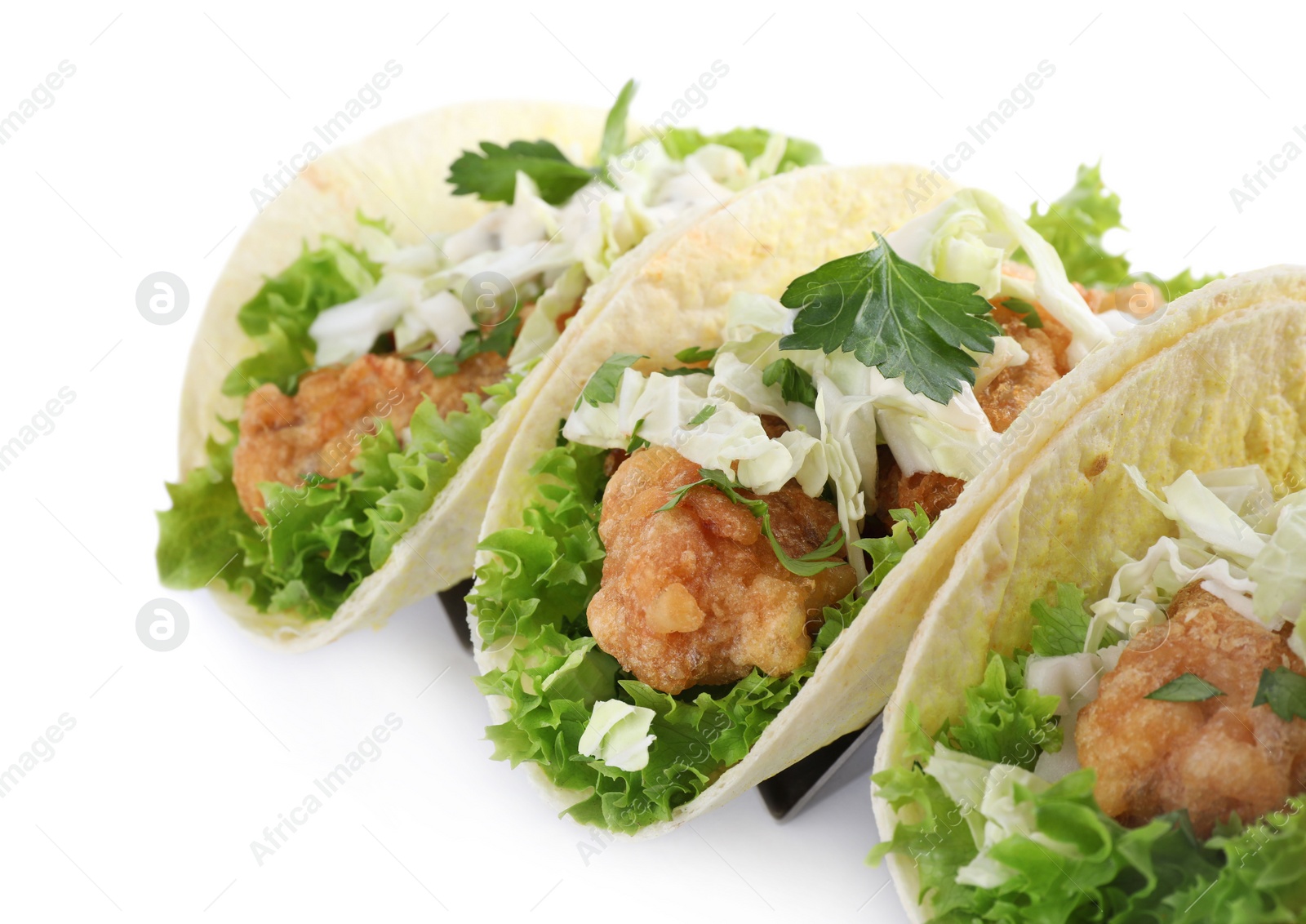 Yummy fish tacos in holder isolated on white, closeup Photo of Yummy fish tacos in holder isolated on white, closeup