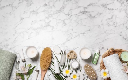 Flat lay composition with spa essentials on white marble background. Space for text Photo of Flat lay composition with spa essentials on white marble background. Space for text