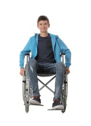 Teen boy in wheelchair on white background Photo of Teen boy in wheelchair on white background