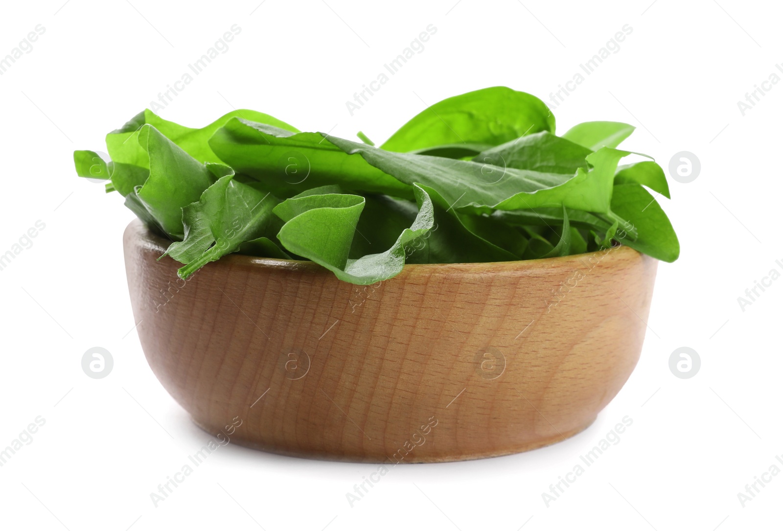 Fresh green sorrel leaves in wooden bowl isolated on white Photo of Fresh green sorrel leaves in wooden bowl isolated on white