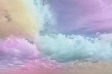 Fantasy world. Picturesque view of beautiful magic sky with fluffy clouds, toned in pastel rainbow or unicorn colors Image of Fantasy world. Picturesque view of beautiful magic sky with fluffy clouds, toned in pastel rainbow or unicorn colors