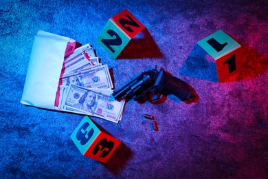 Flat lay composition with evidences on stone background, toned in red and blue. Crime scene Photo of Flat lay composition with evidences on stone background, toned in red and blue. Crime scene