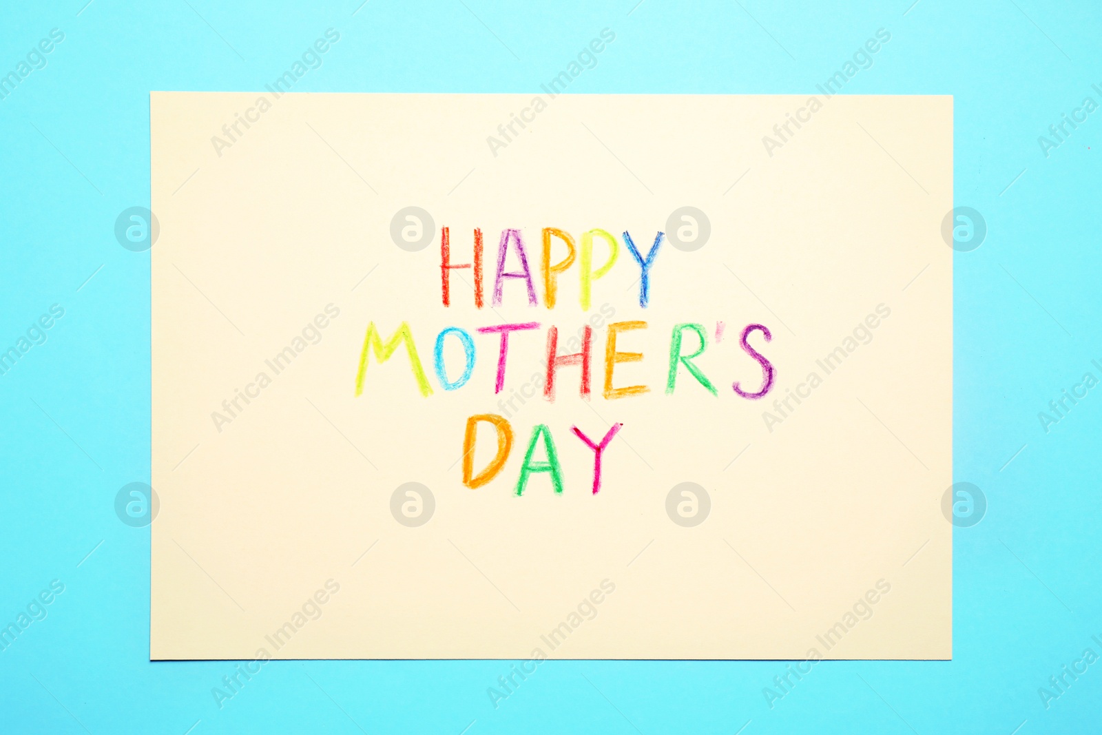 Greeting card with text Happy Mother's day on light blue background, top view Photo of Greeting card with text Happy Mother's day on light blue background, top view