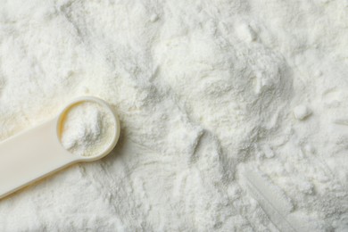 Top view of powdered infant formula and scoop, space for text. Baby milk Photo of Top view of powdered infant formula and scoop, space for text. Baby milk