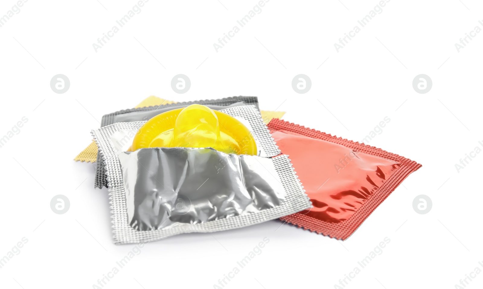 Condom packages on white background. Safe sex Photo of Condom packages on white background. Safe sex