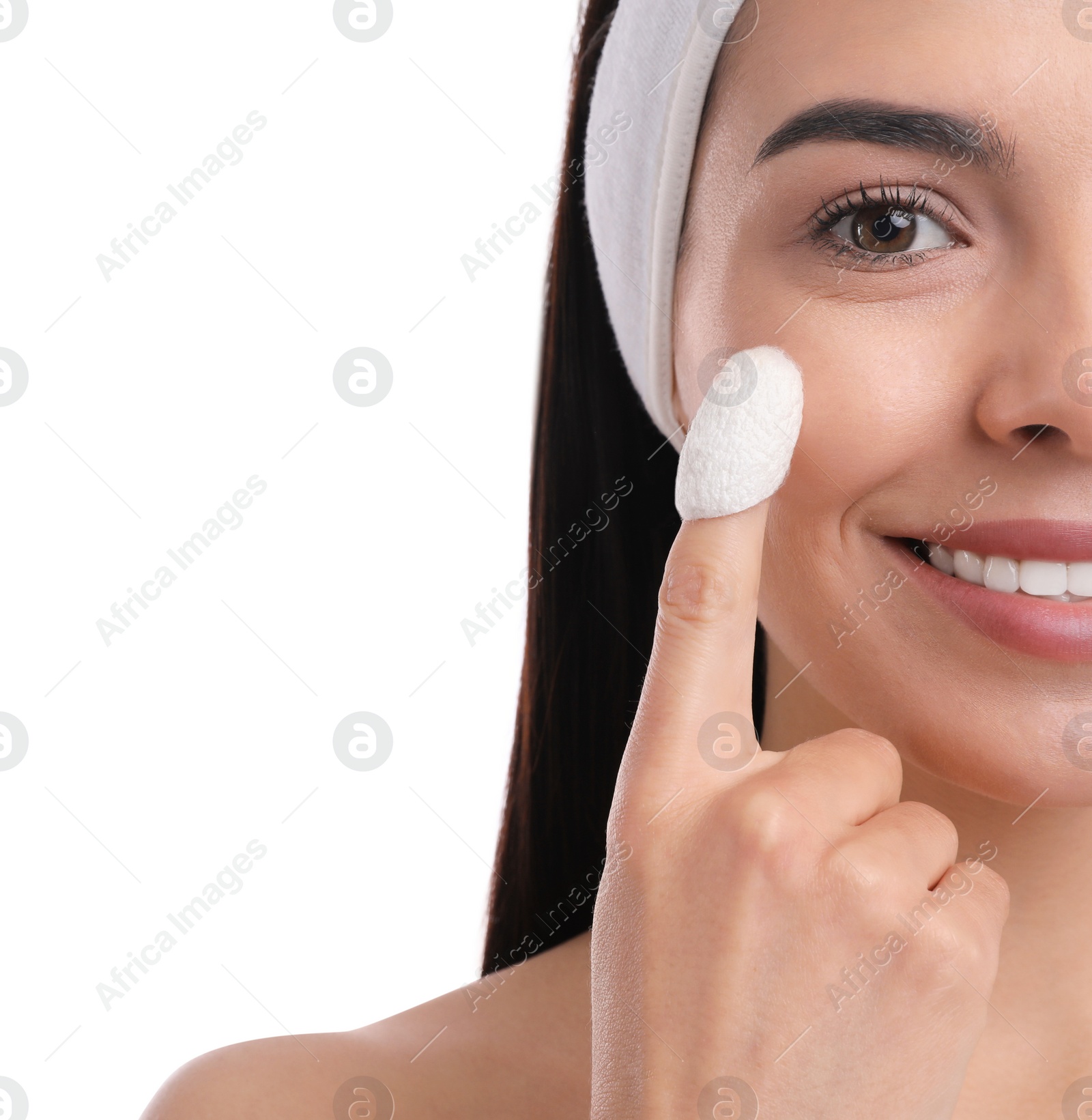 Woman using silkworm cocoon in skin care routine on white background Photo of Woman using silkworm cocoon in skin care routine on white background