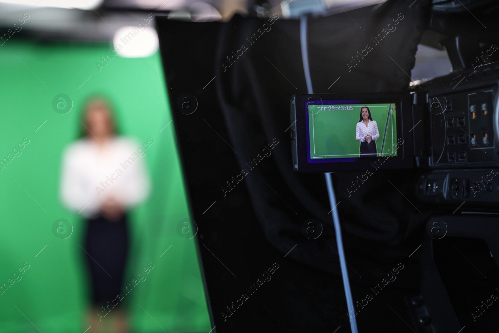 Presenter working in studio, focus on video camera screen Photo of Presenter working in studio, focus on video camera screen