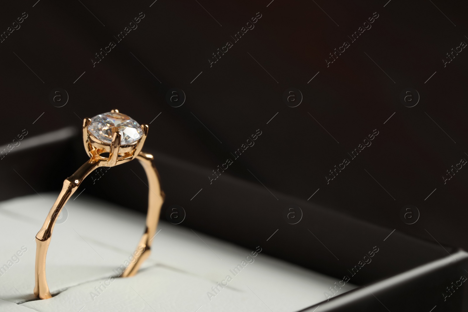 Beautiful engagement ring in box, closeup. Space for text Photo of Beautiful engagement ring in box, closeup. Space for text