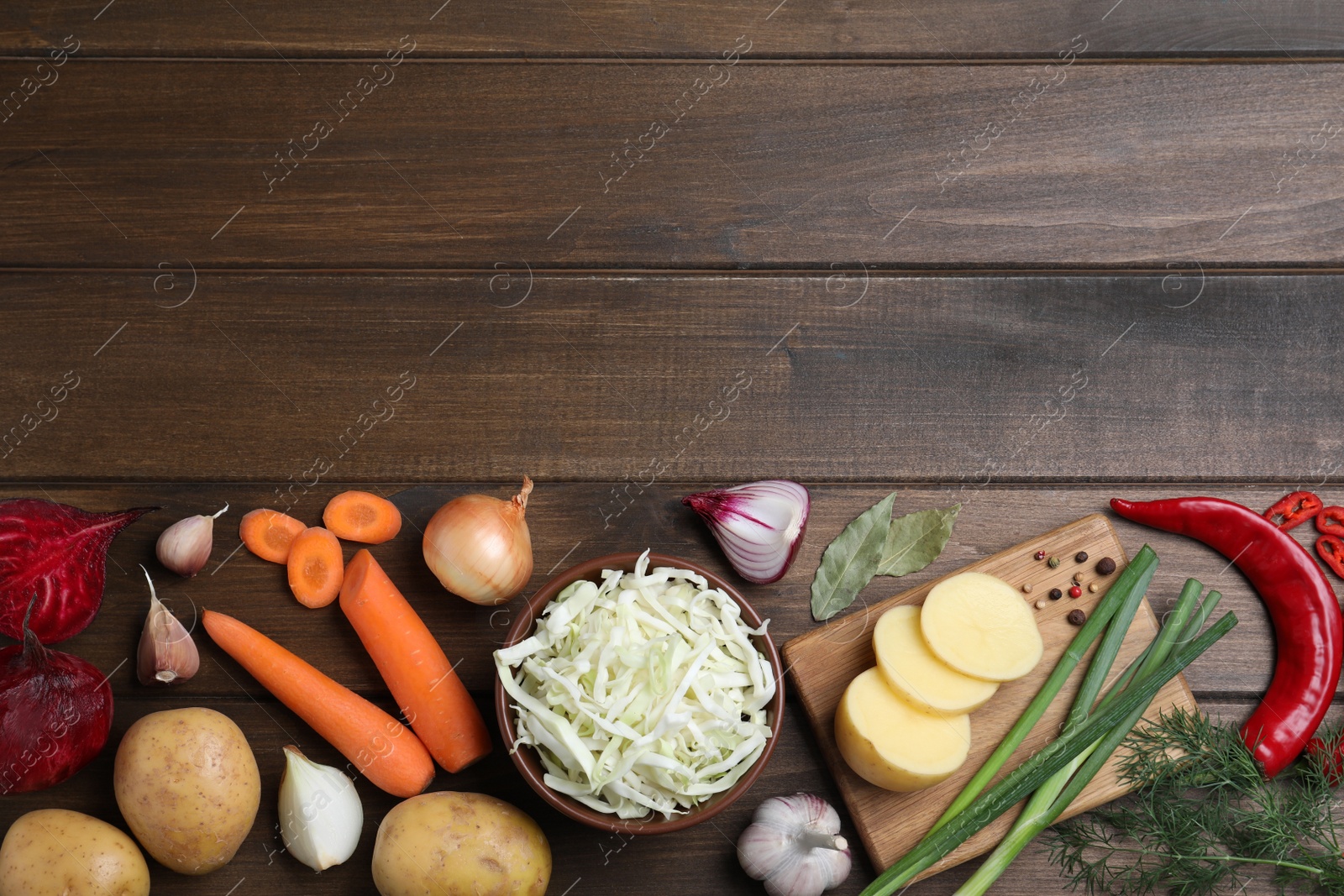 Fresh borscht ingredients on wooden table, flat lay. Space for text Photo of Fresh borscht ingredients on wooden table, flat lay. Space for text