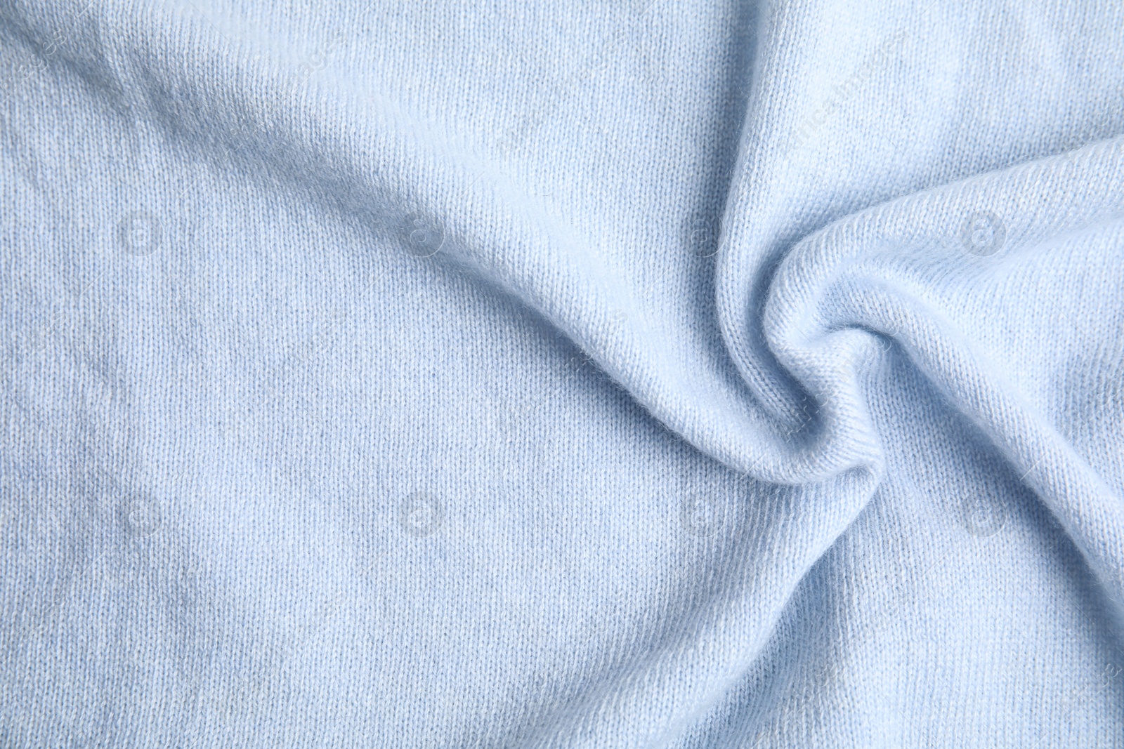 Photo of Warm cashmere sweater as background, top view