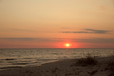 Beautiful view of sky over sea at sunset Photo of Beautiful view of sky over sea at sunset