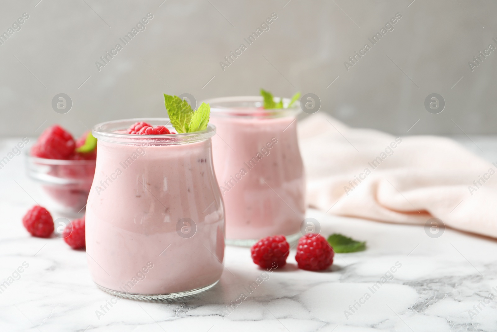 Yummy raspberry smoothie on white marble table Image of Yummy raspberry smoothie on white marble table