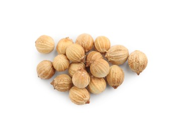 Heap of dried coriander seeds on white background, top view Photo of Heap of dried coriander seeds on white background, top view