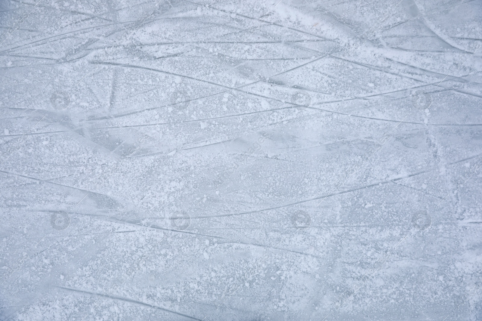 Traces left by figure skate blades on ice. Winter outdoors activities Photo of Traces left by figure skate blades on ice. Winter outdoors activities