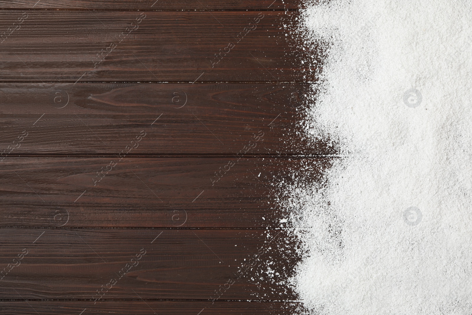 Artificial snow on wooden background, top view with space for text. Christmas decor Photo of Artificial snow on wooden background, top view with space for text. Christmas decor