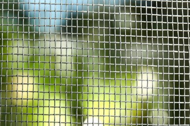 Insect screen for window against blurred background, closeup Photo of Insect screen for window against blurred background, closeup