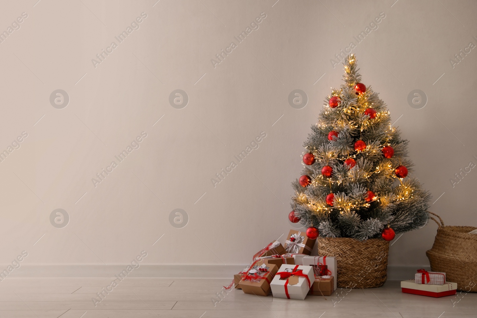 Pile of gift boxes near beautiful Christmas tree indoors, space for text. Advent calendar Photo of Pile of gift boxes near beautiful Christmas tree indoors, space for text. Advent calendar