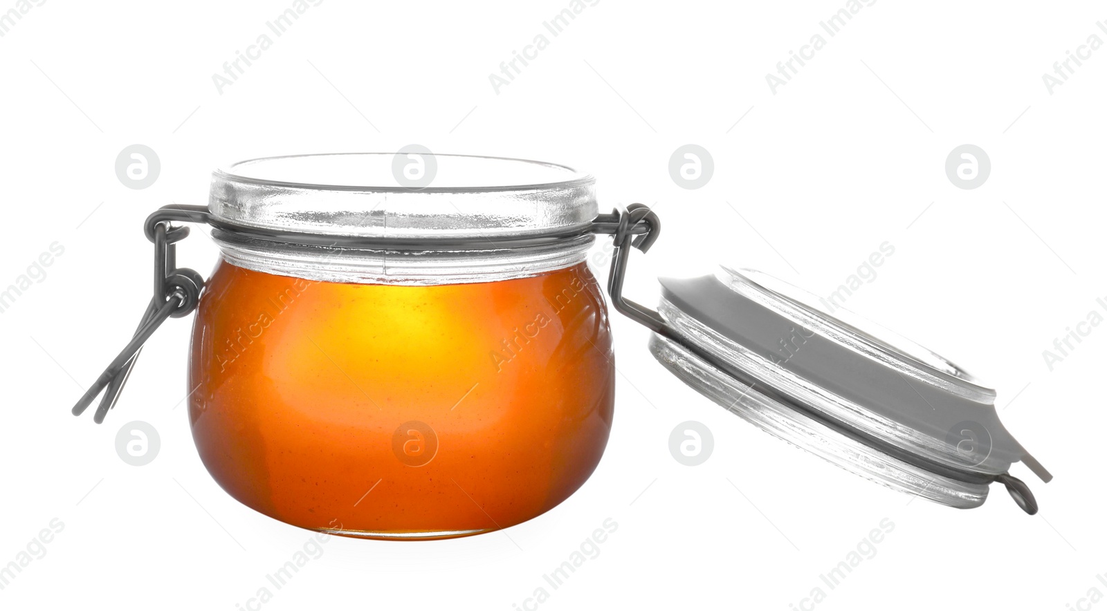 Jar with organic honey isolated on white Photo of Jar with organic honey isolated on white