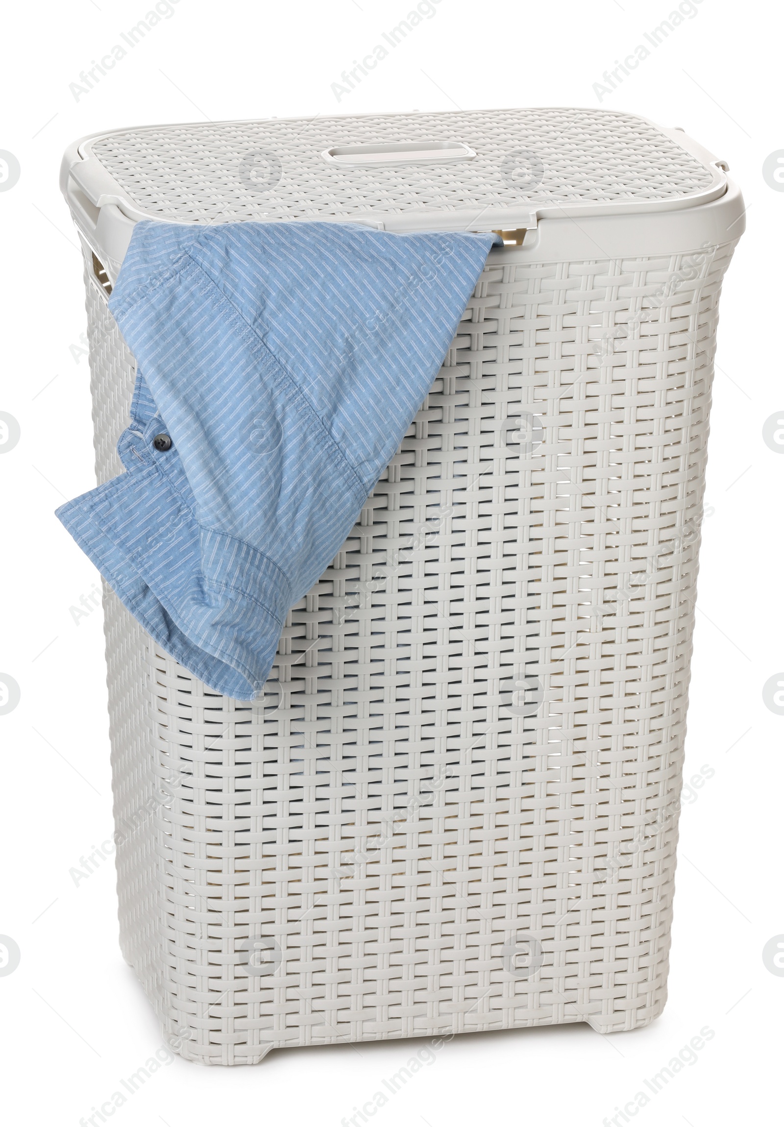 Plastic laundry basket with garment isolated on white Photo of Plastic laundry basket with garment isolated on white