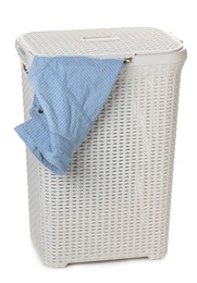 Plastic laundry basket with garment isolated on white Photo of Plastic laundry basket with garment isolated on white