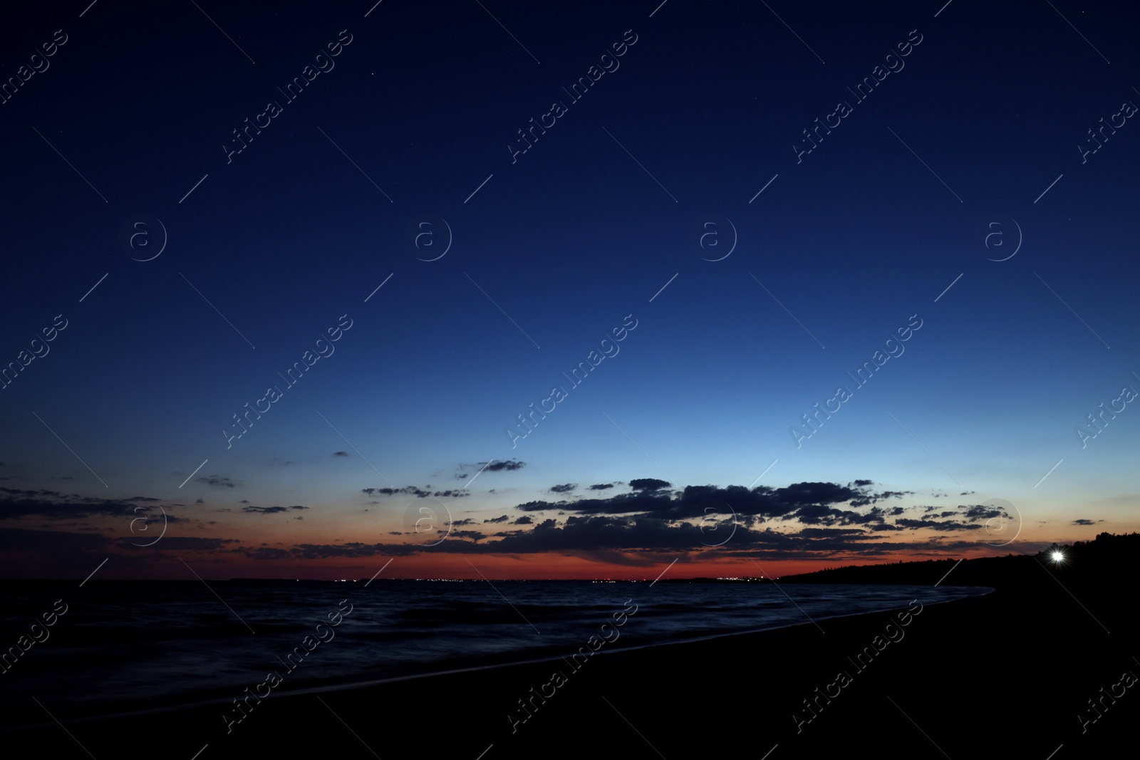 Picturesque view of beautiful sunset on seaside at night Photo of Picturesque view of beautiful sunset on seaside at night