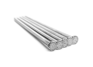 Many shiny metal nails on white background Photo of Many shiny metal nails on white background