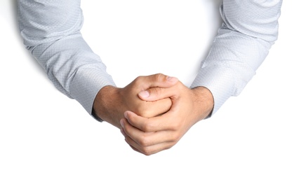 Man on white background, top view. Closeup of hands Photo of Man on white background, top view. Closeup of hands