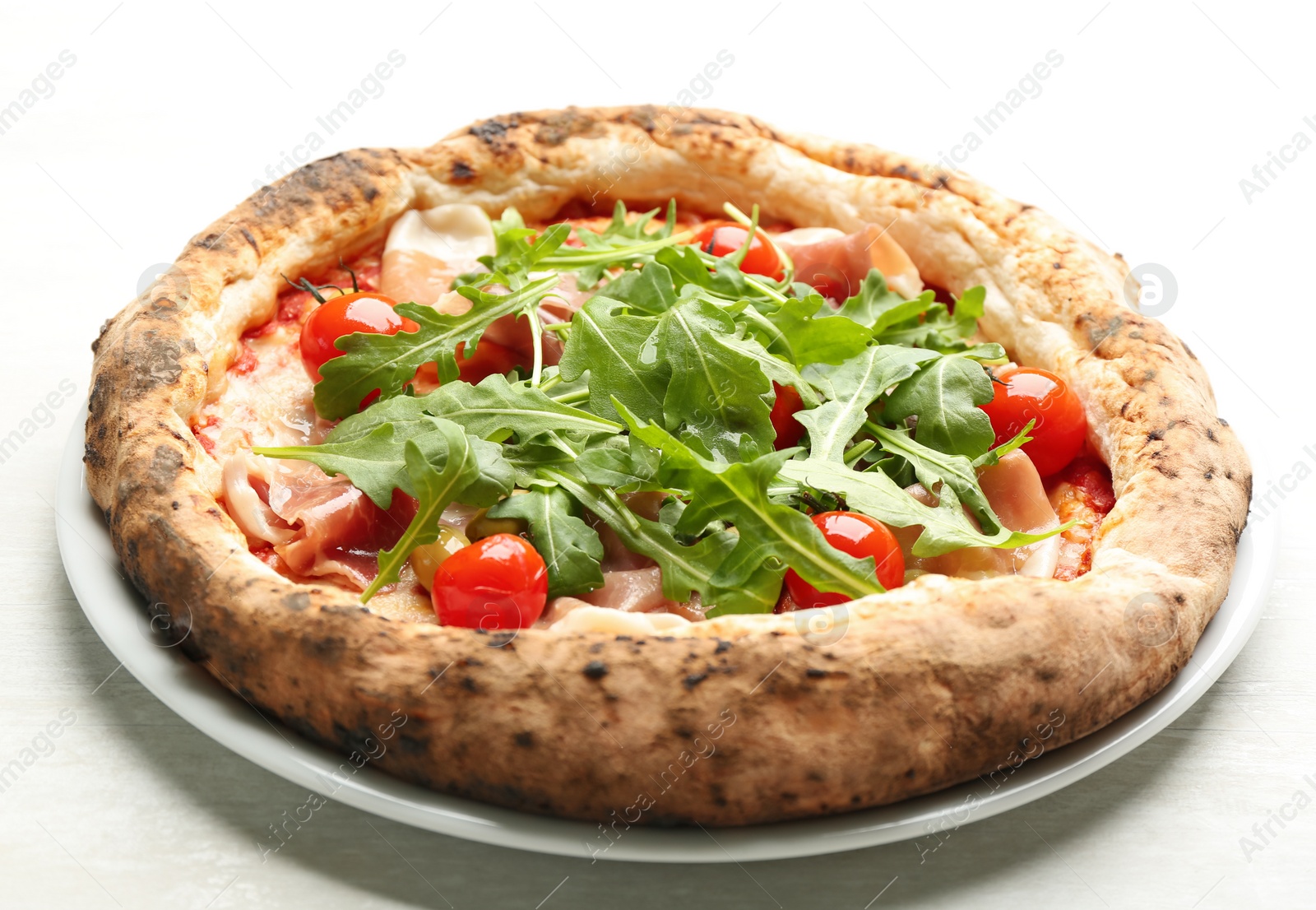 Tasty pizza with meat and arugula on white table, closeup Photo of Tasty pizza with meat and arugula on white table, closeup