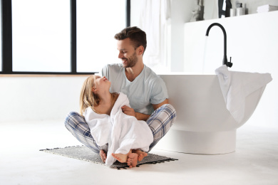 Photo of Father and his cute little daughter in bathroom