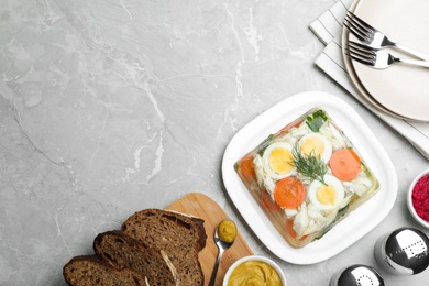 Delicious fish aspic served on grey marble table, flat lay. Space for text Photo of Delicious fish aspic served on grey marble table, flat lay. Space for text