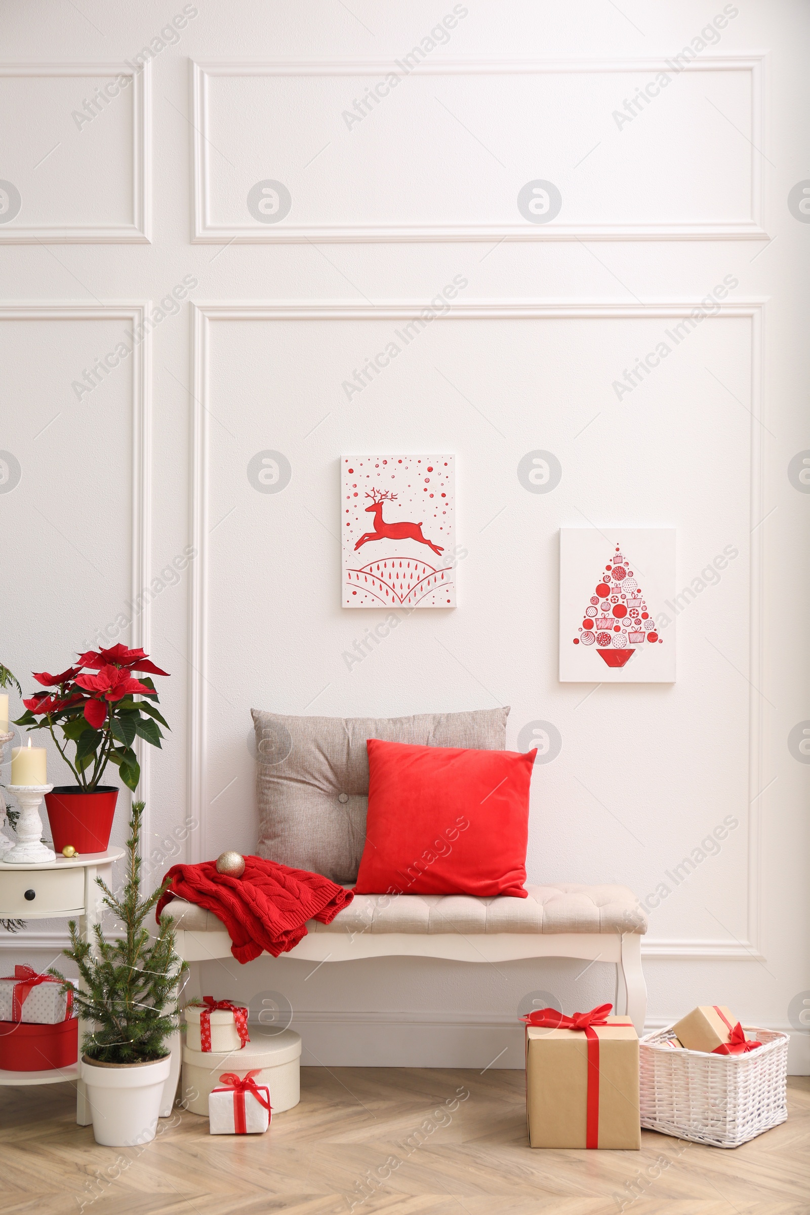 Christmas themed pictures in bright room with festive decorations. Interior design Photo of Christmas themed pictures in bright room with festive decorations. Interior design